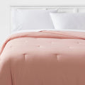 Twin/Twin Extra Long Reversible Microfiber Micro Texture Comforter Light Pink - Room Essentials
